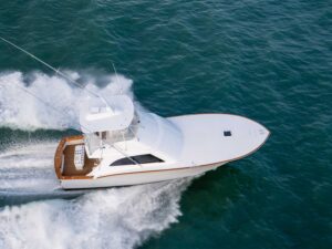 The Blackwell Boatworks 50XL sport-fishing boat cruises across the blue water.
