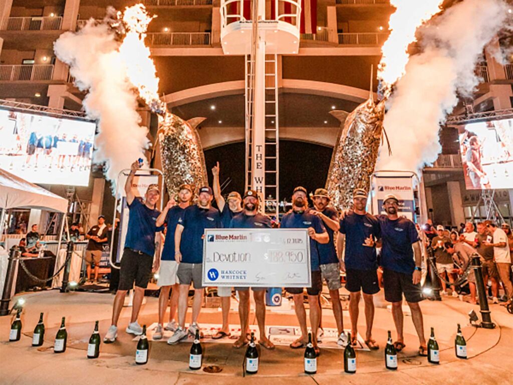 Flames erupt from marlin statues at the 2025 Blue Marlin Grand Championship as team Devotion celebrates a win