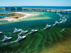 Aerial view of the Orange Beach bay as a fleet of sport-fishing boats cruise across the water.