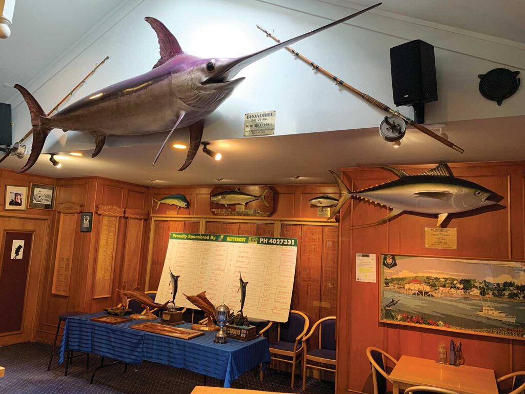 View of a fishing club wall with trophy mounts.