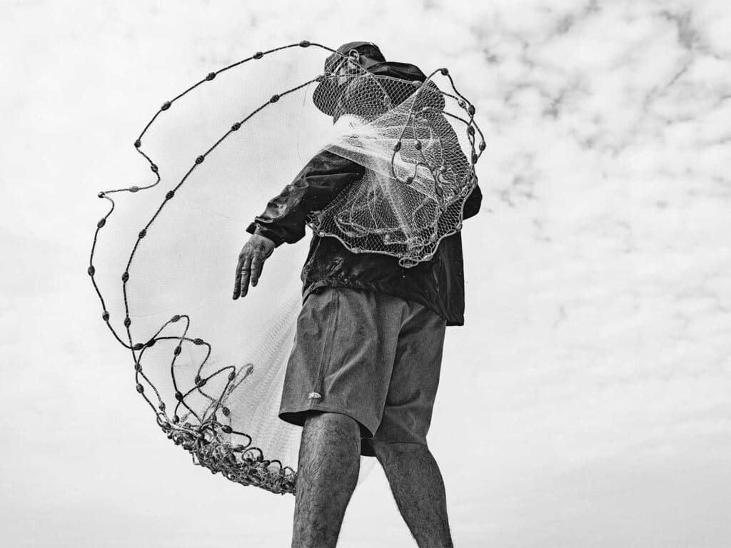 An angler prepares a cast net.