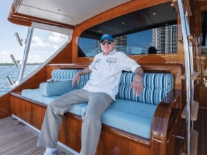 Rybovich seated in the mezzanine of a sport-fishing boat.