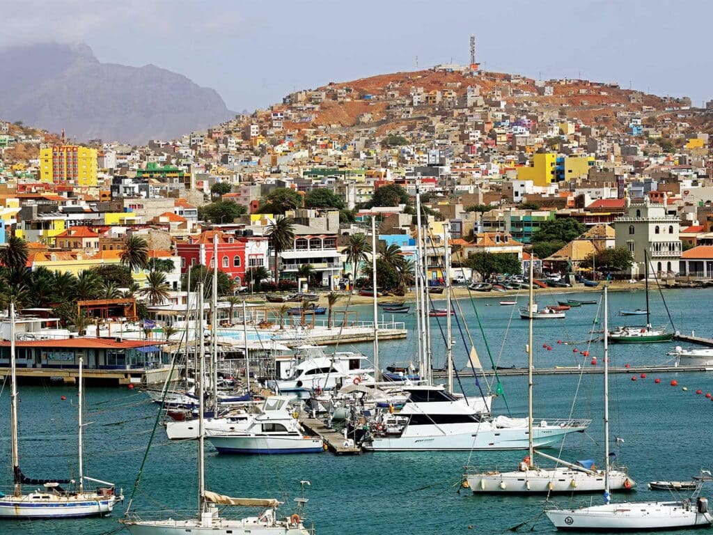 View of the docks and marina and cityscape beyond of Cape Verde's coastal city.