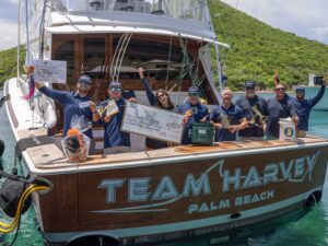 Team Harvey aboard their sport-fishing boat, celebrating their victory.
