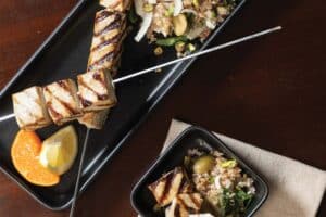 A plate of grilled swordfish skewers.