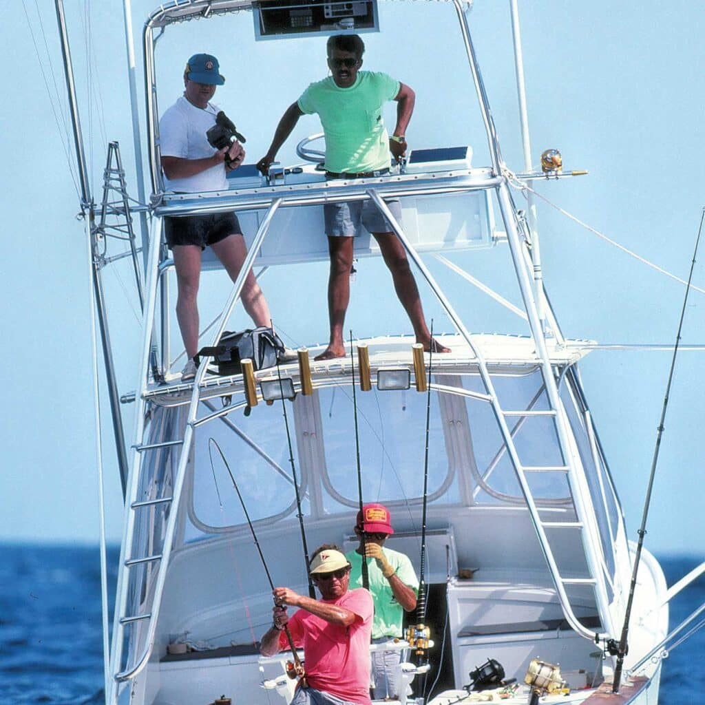 Tim Choate and crew aboard a sport-fishing boat.
