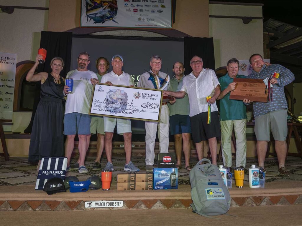 A team of anglers at an awards ceremony.