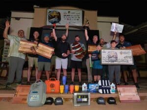 A team of anglers at an awards ceremony.