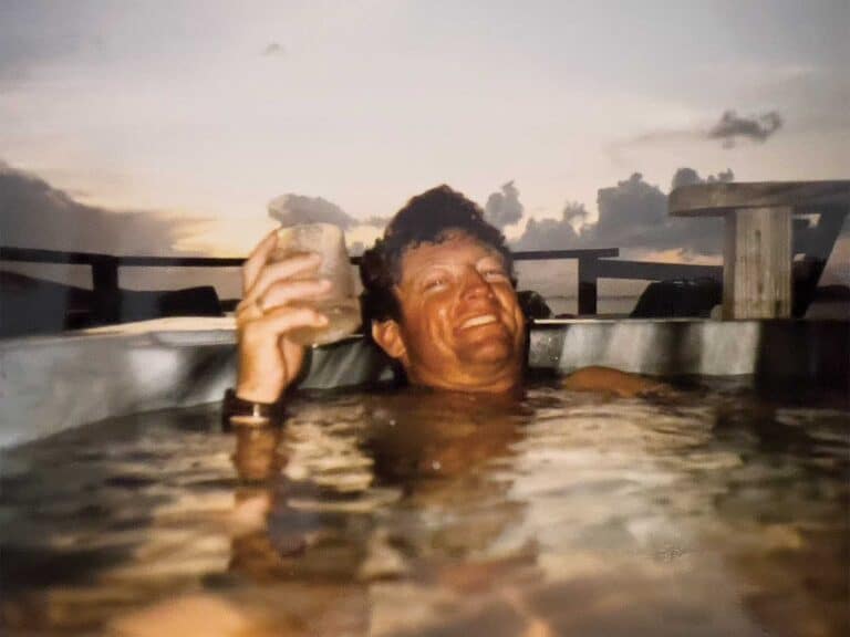 Vintage photo of Tim Choate relaxing in a hot tub.