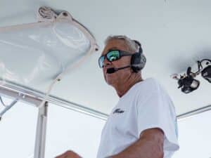 Capt. Rom Whitaker at the helm of his sport-fishing boat.