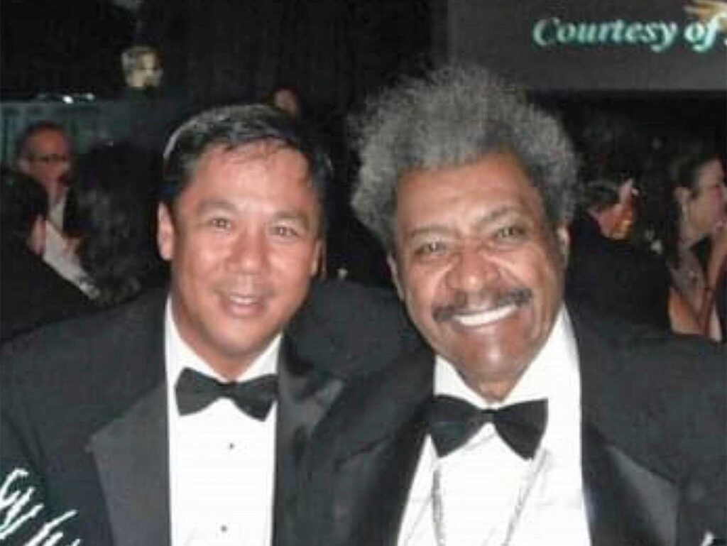 Carey Chen at an awards ceremony with a celebrity.