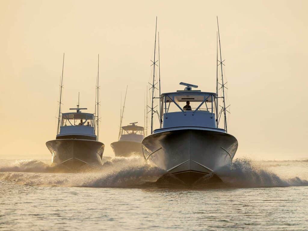 A fleet of sport-fishing boats on the water.