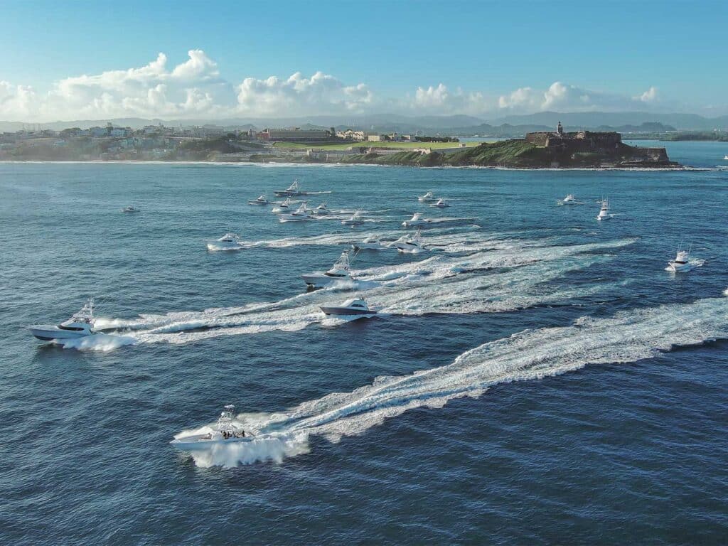 Aerial view of a fleet of sport-fishing boats setting off for a day of fishing at the 2025 San Juan International Billfish Tournament