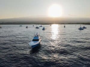 A fleet of sport-fishing boats on the water for a day of fishing.