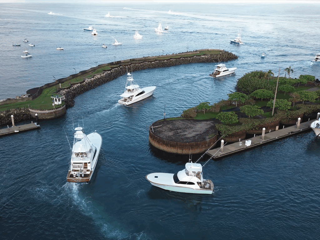 A fleet of sport-fishing boats makes their way out of the marina Pez Vela for the 2025 Flor de Cana tournament