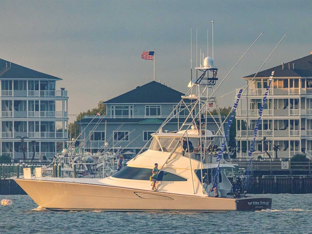 A sport-fishing boat cruises across the water.