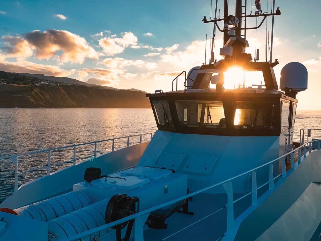 A setting sun against the bridge of Bad Company.