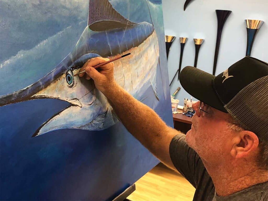 Capt. RJ Boyle painting a picture of a Swordfish.