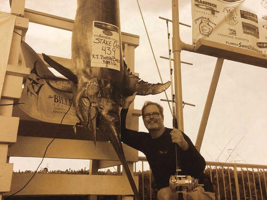 Capt. RJ Boyle next to a swordfish at the Miami Sportfish Tournament of 2012.