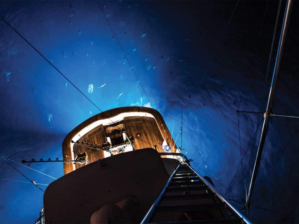 Night time lights underneath a sport-fishing boat