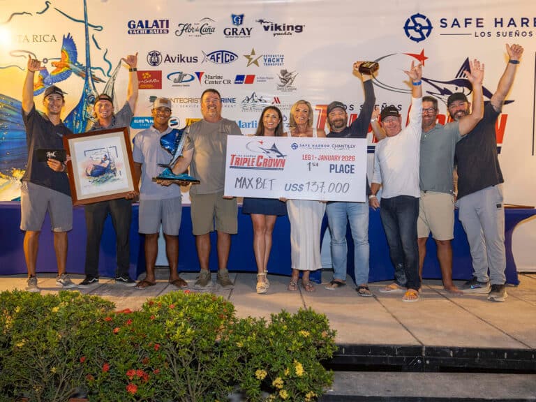 Team Max Bet at the 2026 Los Suenos Signature Triple Crown Awards ceremony. They hold up an oversized check and several trophies.