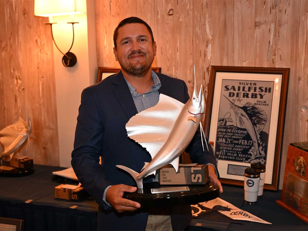 Matthew Rodriguez holding up a trophy at the 2026 Silver Sailfish Derby.