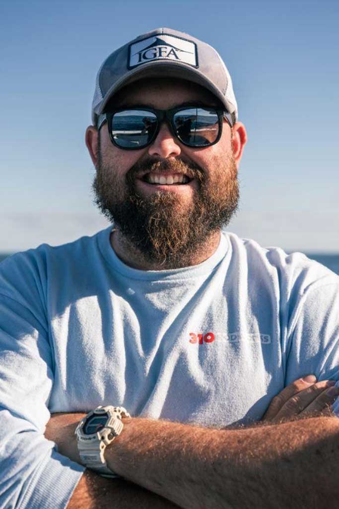 Portrait of Myles Blatt wearing sunglasses.