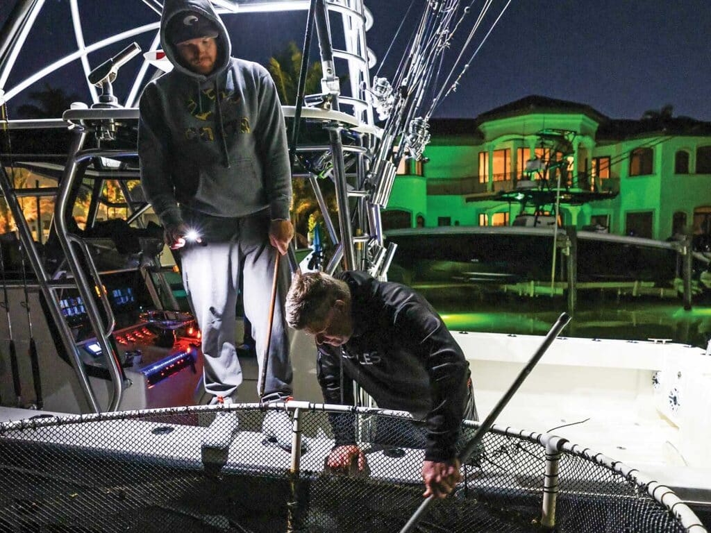 Two crew tend to live bait.