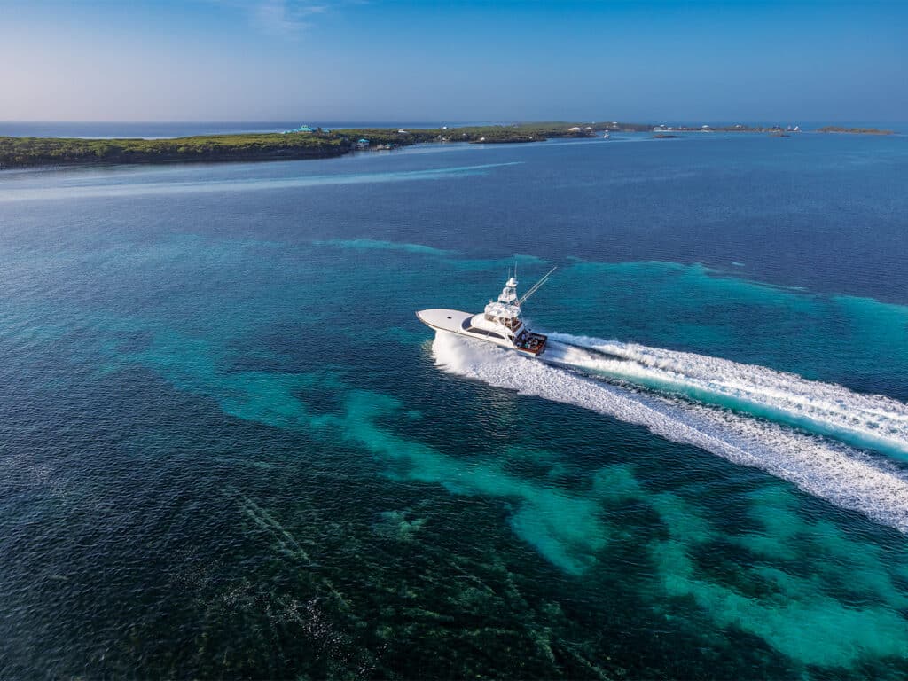 A sport-fishing boat cruises across the water.