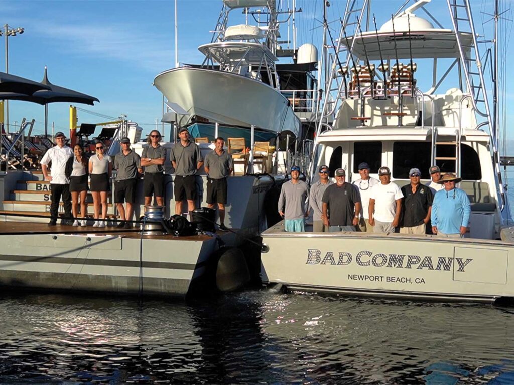 Team Bad Company standing on the docks to pose for a group photo