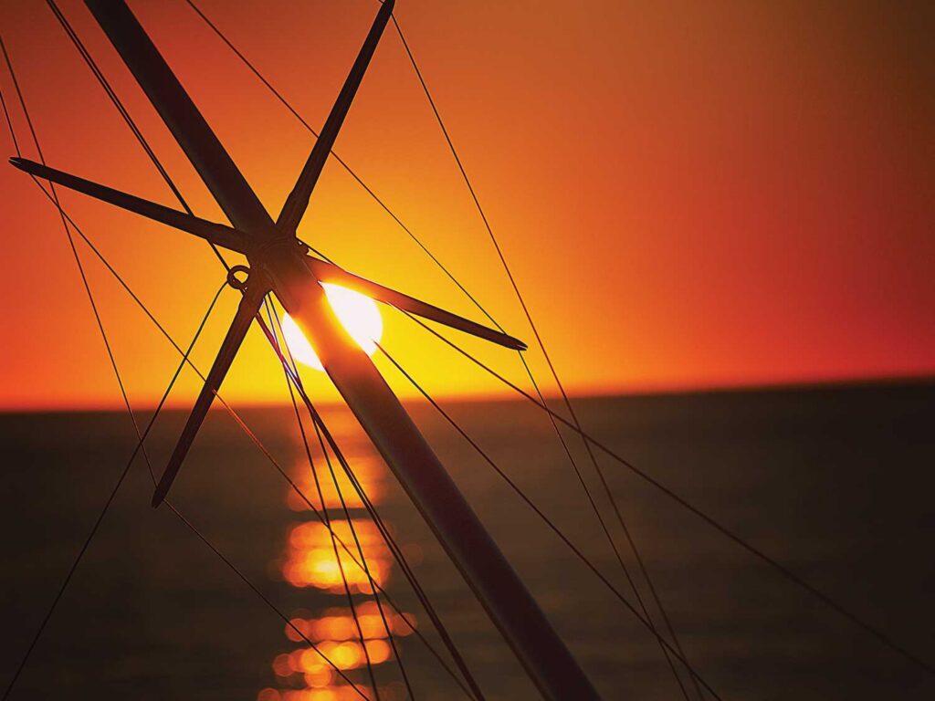 An outrigger silhouetted against the sunset.