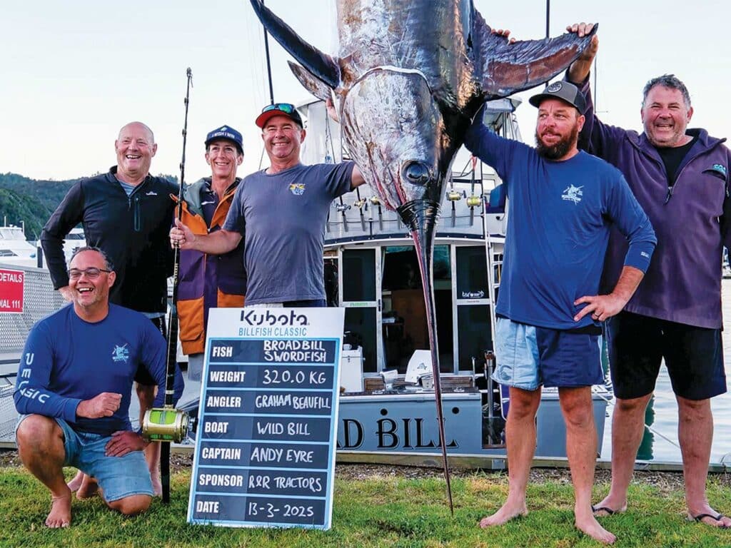 Anglers next to a large broadbill swordfish