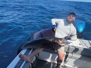 Marlin Expeditions Director Myles Blatt with a sailfish.