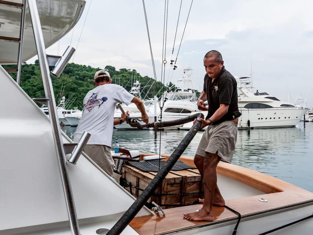 Crew fueling up a sport-fishing boat.