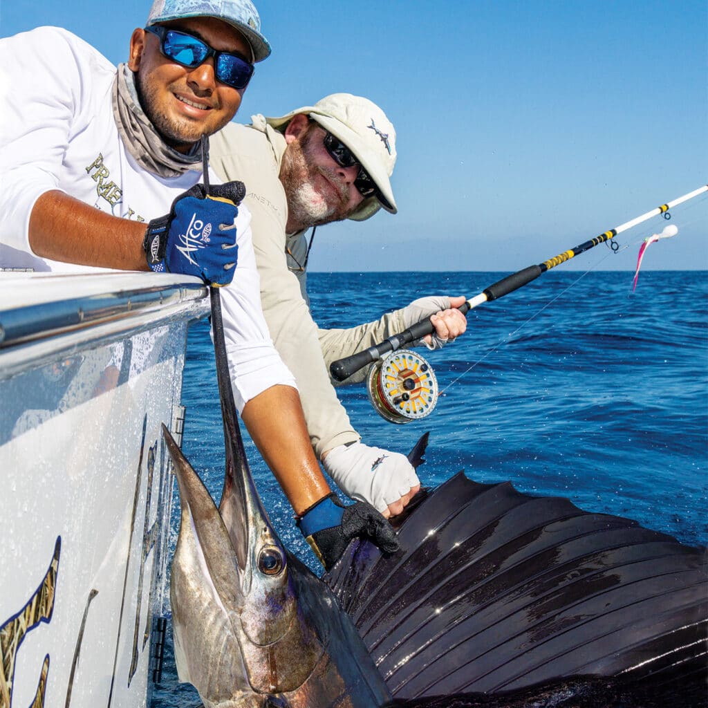 Two anglers sailfish
