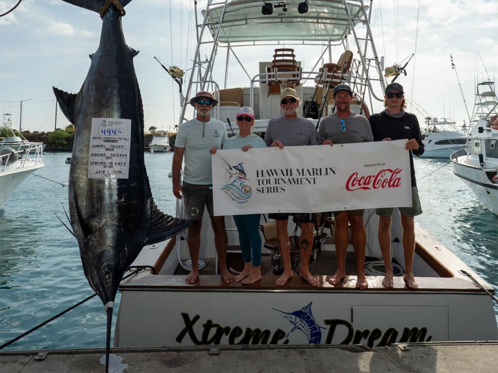 Team next to marlin