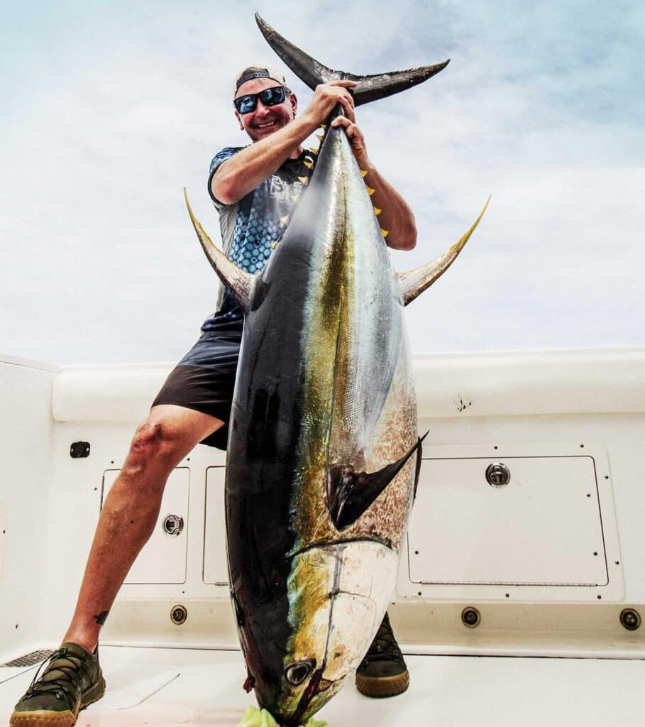 Angler holding up tuna