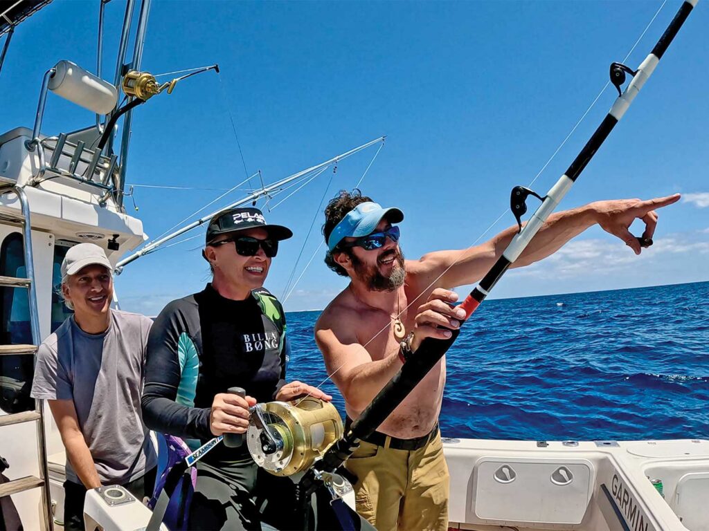 Anglers in the cockpit of a sport-fishing boat.
