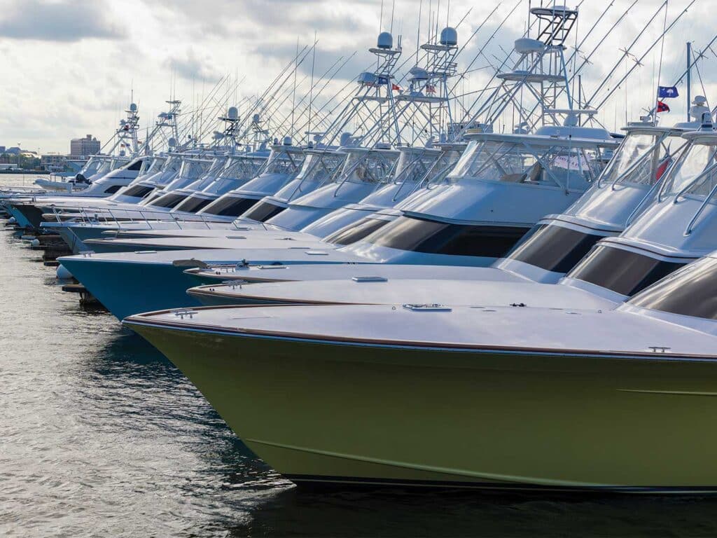 A fleet of sport-fishing boats docked in a marina.