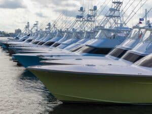 A fleet of sport-fishing boats docked in a marina.