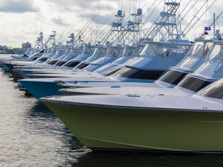 A fleet of sport-fishing boats docked in a marina.