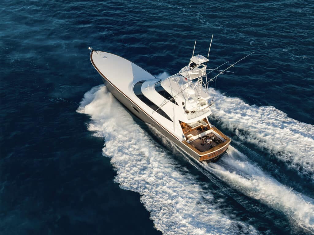 Sport-fishing boat running on water.
