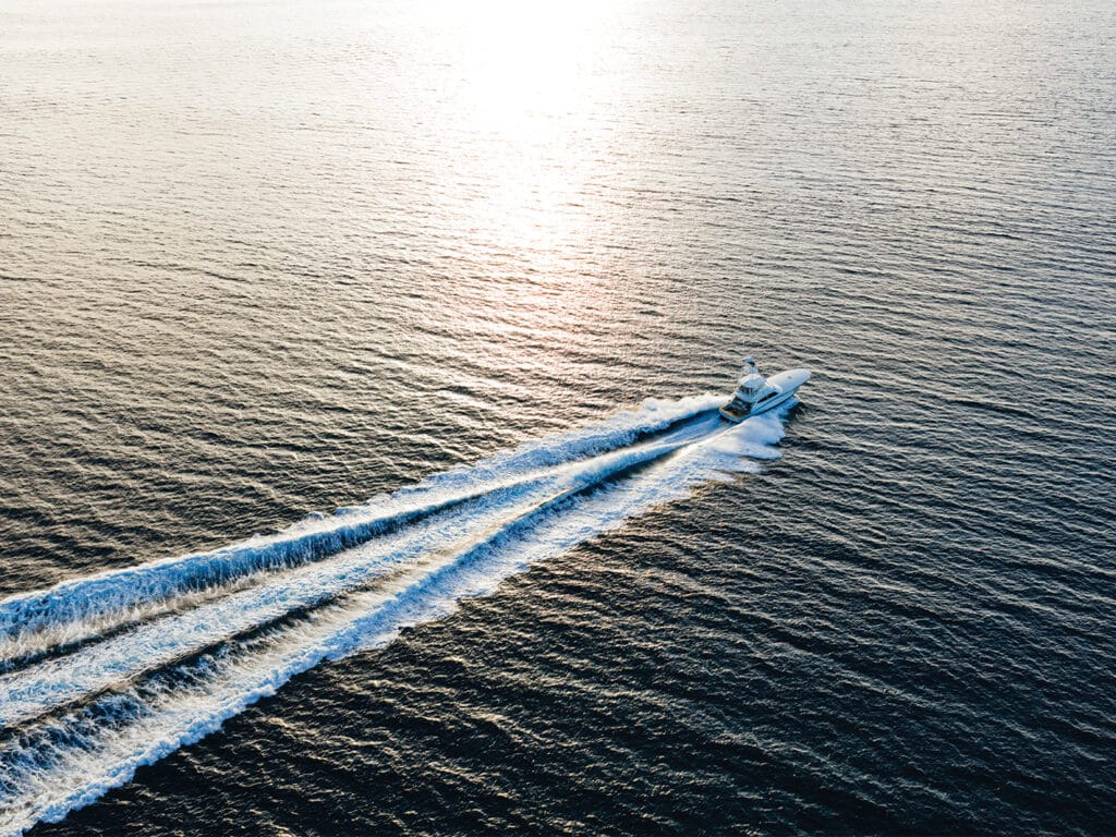 Sport-fishing boat running on water.